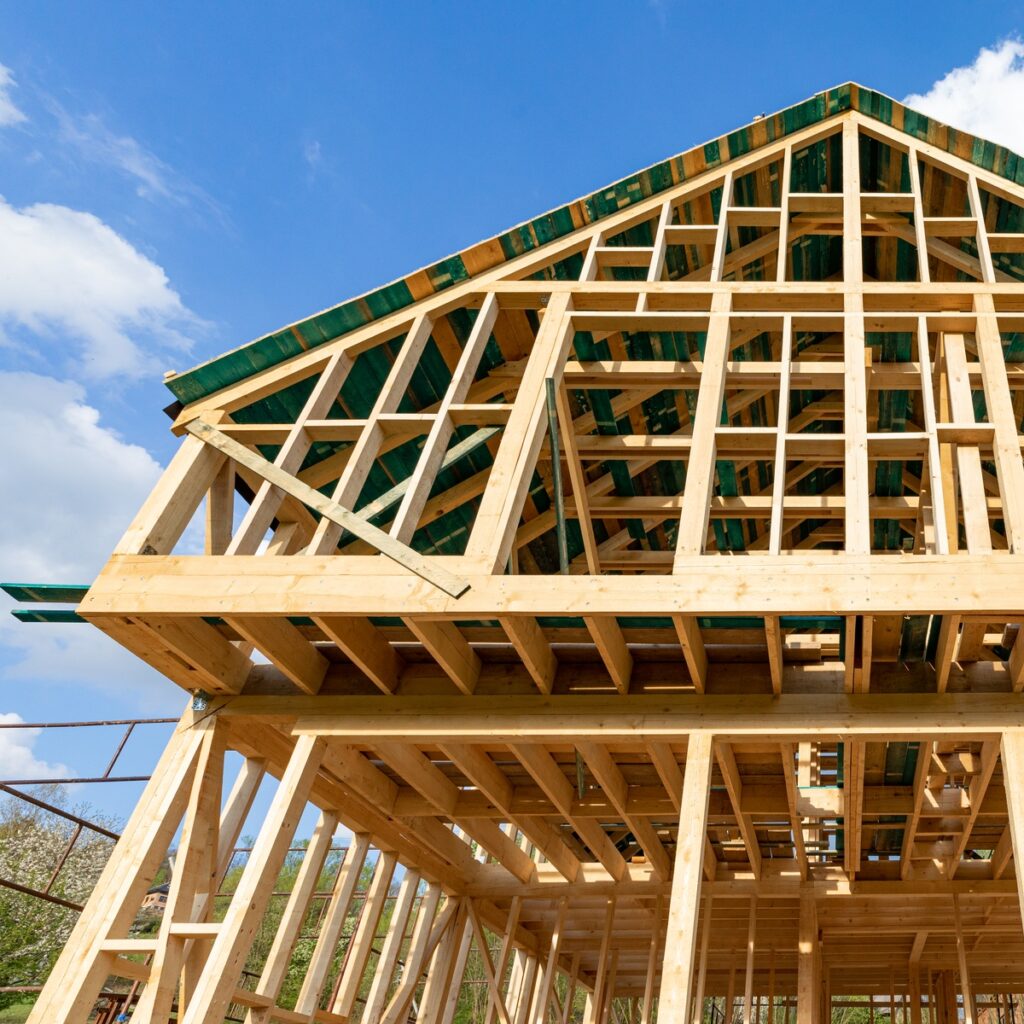 New wooden frame house under construction, outdoor residential home